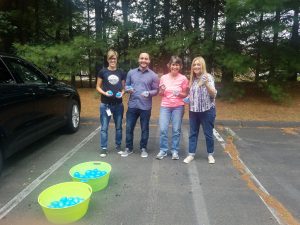 COCC employees participating in water balloon toss challenge